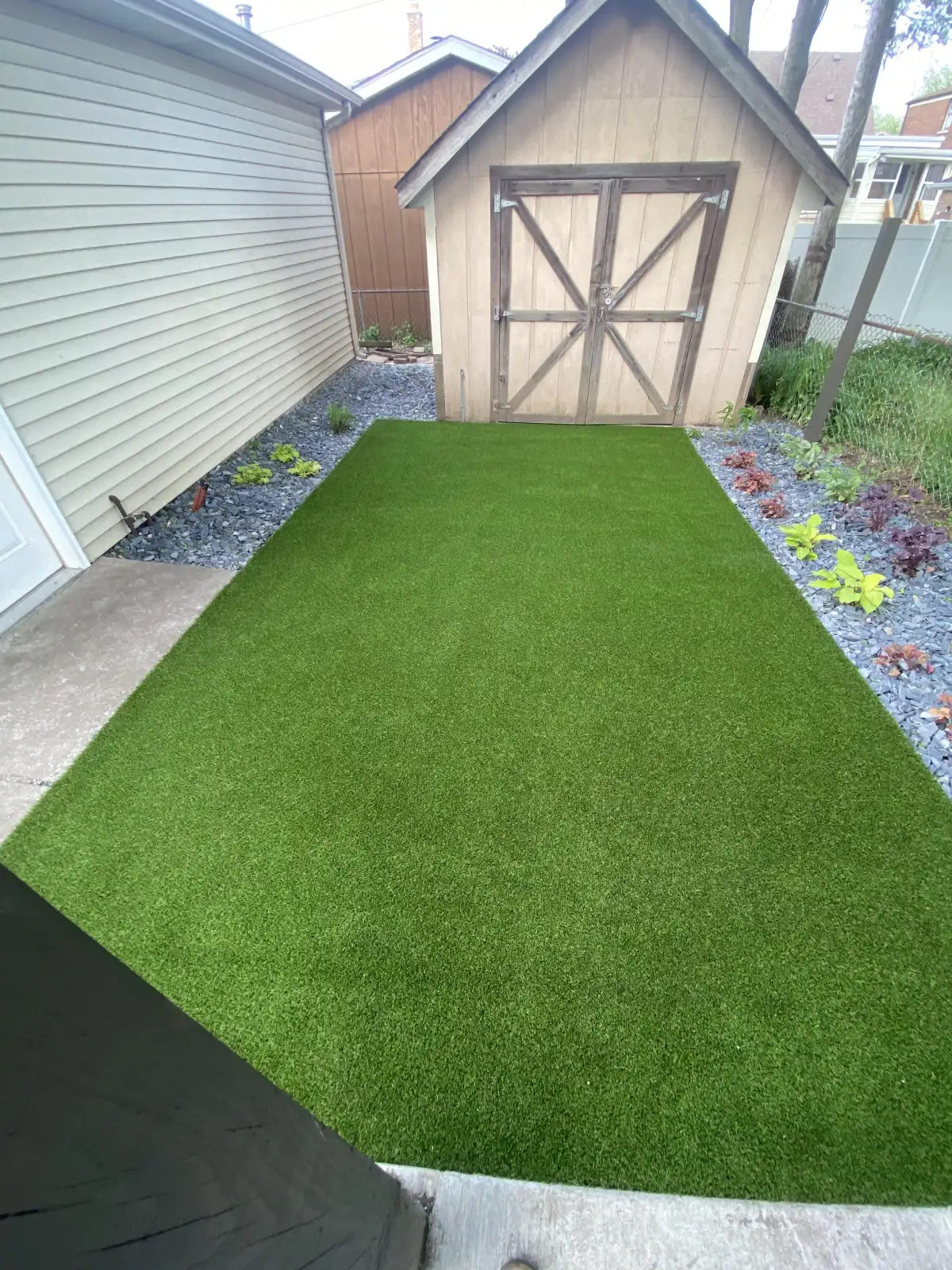 Artificial turf installation scheduled during Michigan spring conditions