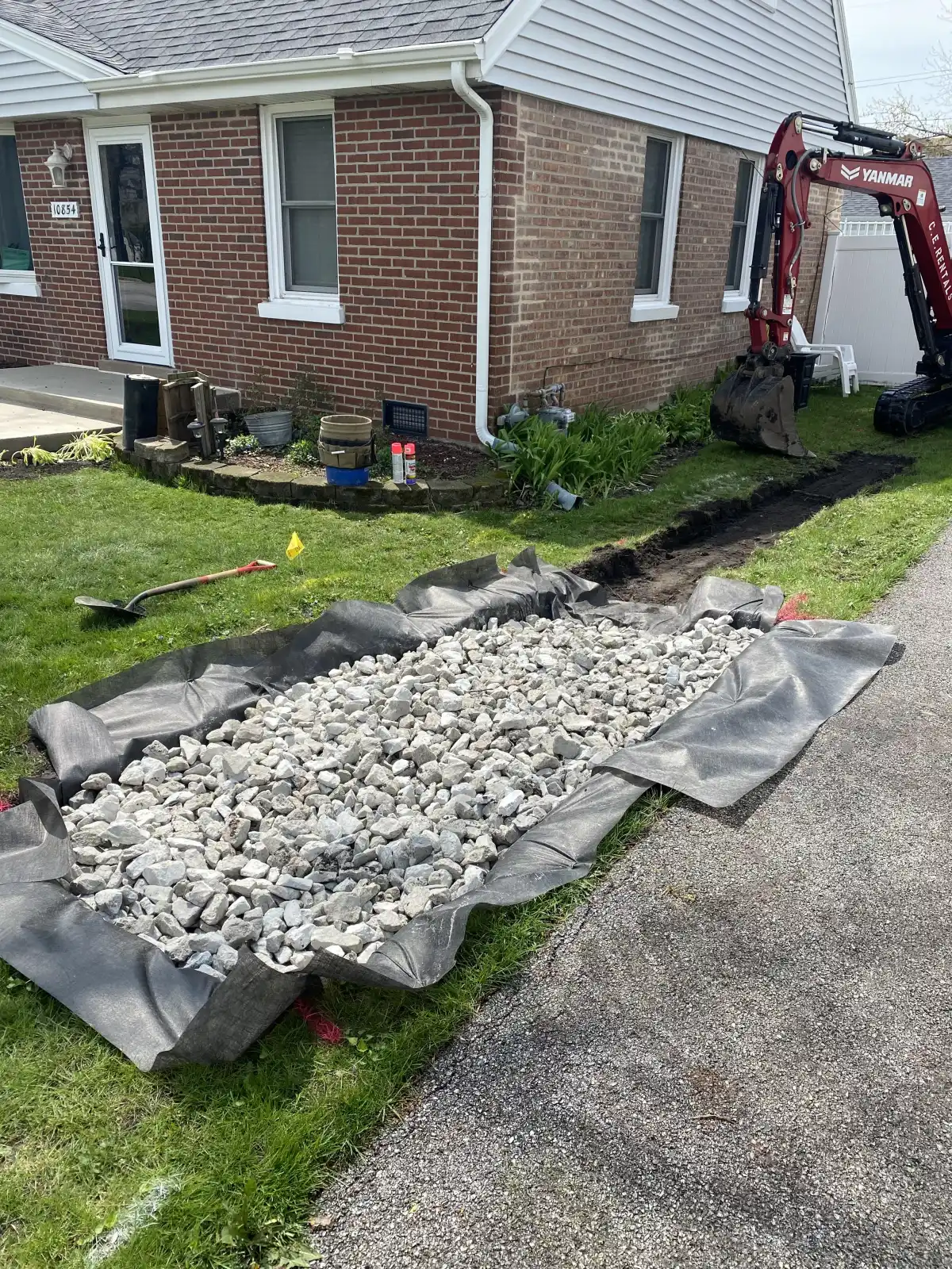 Michigan yard drainage route prepared for stone and pipe