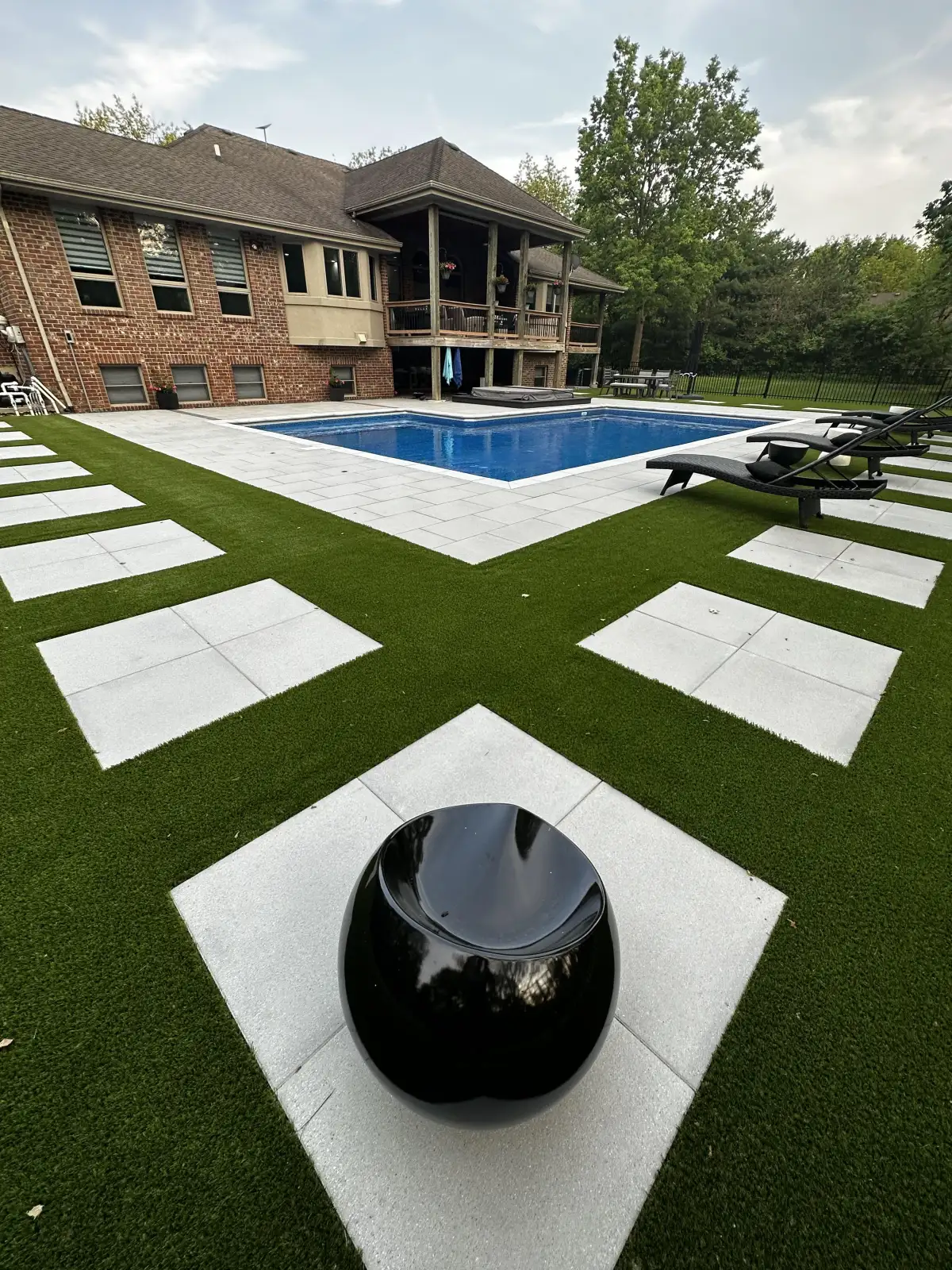 Paver patio with retaining wall in Michigan backyard