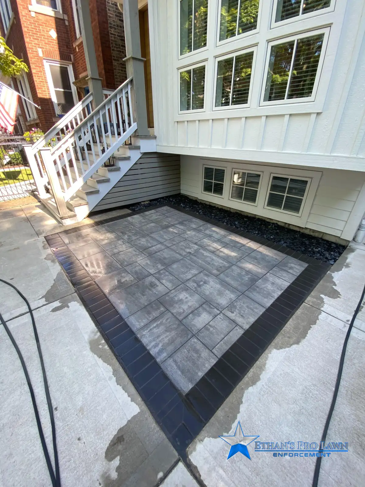 Fire pit seating area with landscape lighting