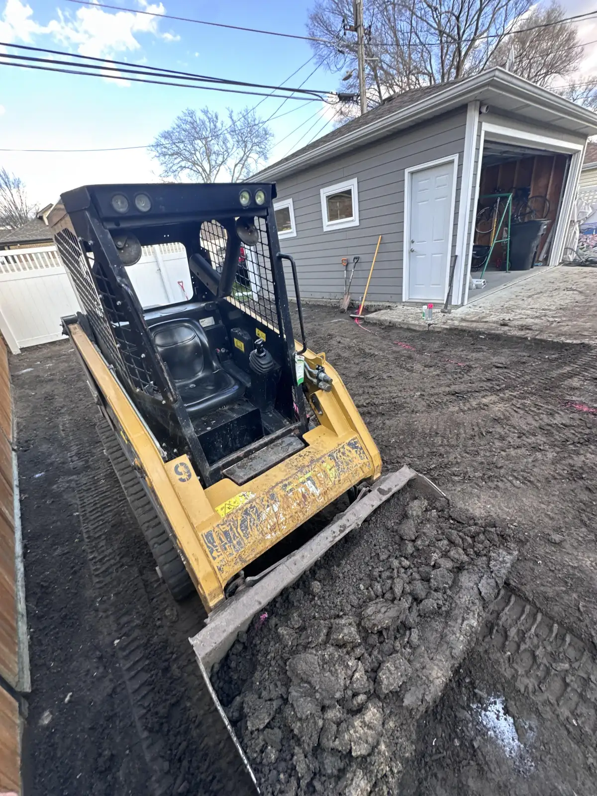 Great Lakes Synthetic Turf crew installing drainage stone base